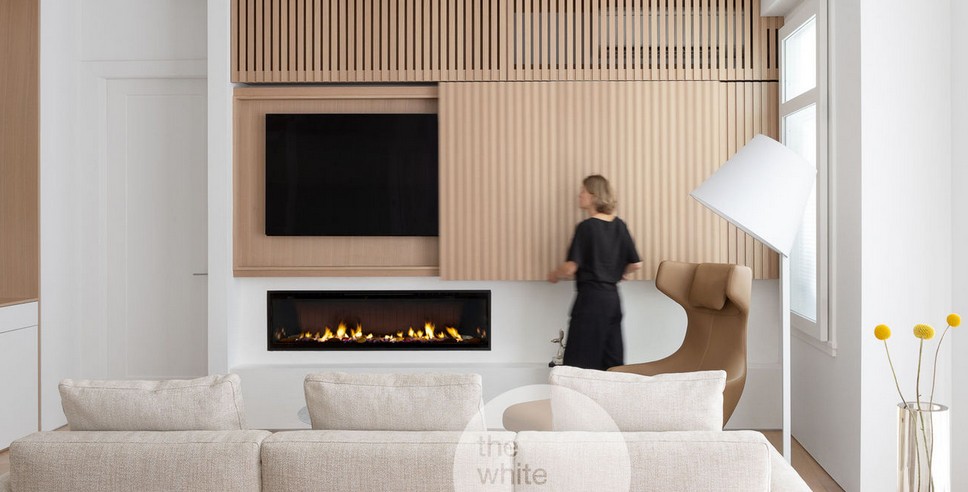Modern living room with linear fireplace and wood slat wall