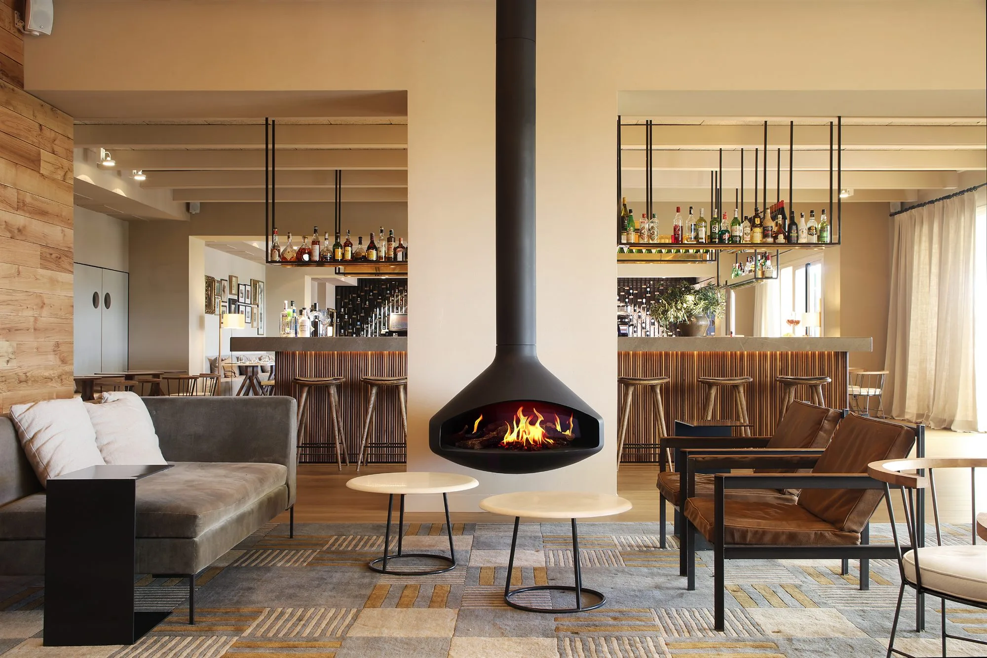 Ergofocus Holographik suspended fireplace installed in a bar lounge interior