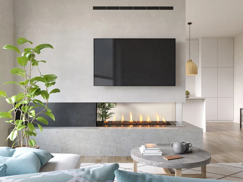 Modern linear gas fireplace with discreet HeatShift vent grille visible at the top of the wall and a television mounted directly above