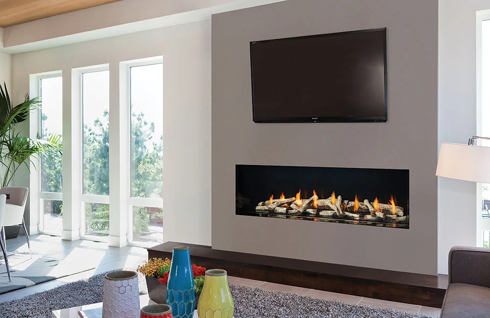 Regency New York View 60 linear gas fireplace in a modern living room with TV mounted above