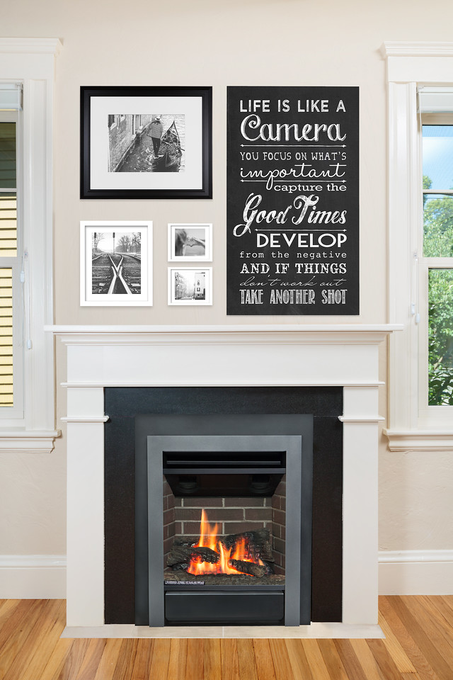 Valor Portrait with a frameless Clearview front in a Craftsman home, brick interior and a black-and-white gallery wall above the mantel